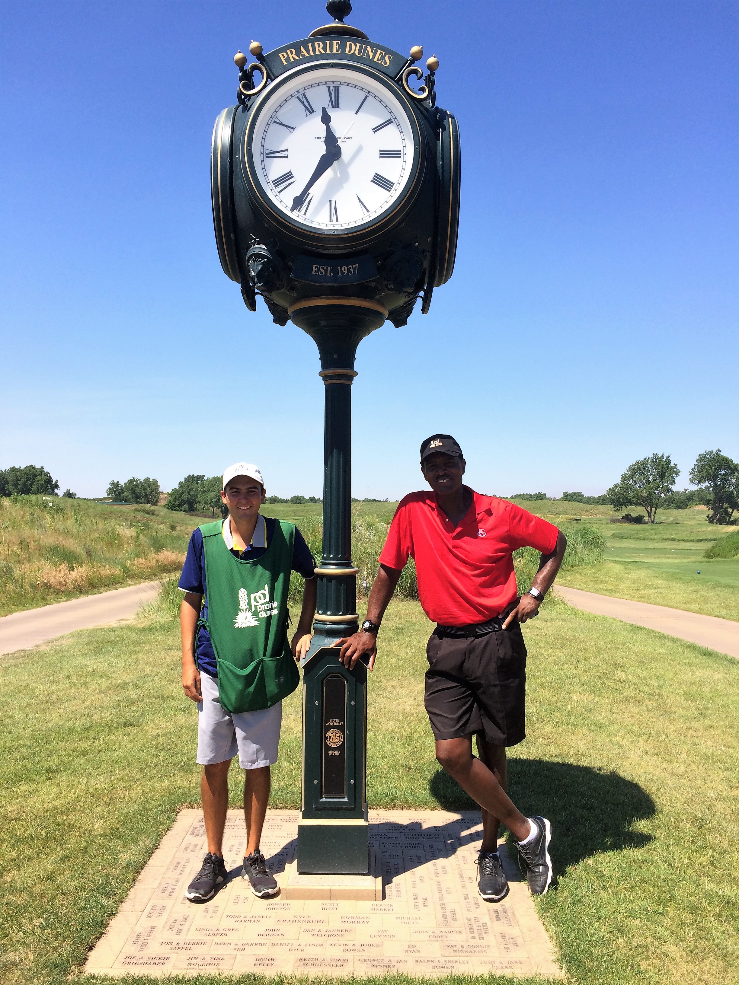 Standing with my caddie Mac following my round