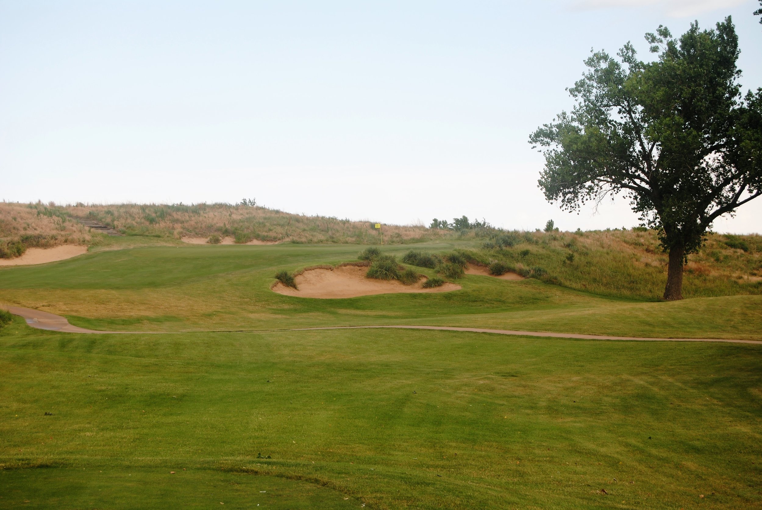 My tee shot on the par 3 4th hole landed short of that far right bunker. I got up and down for a par.