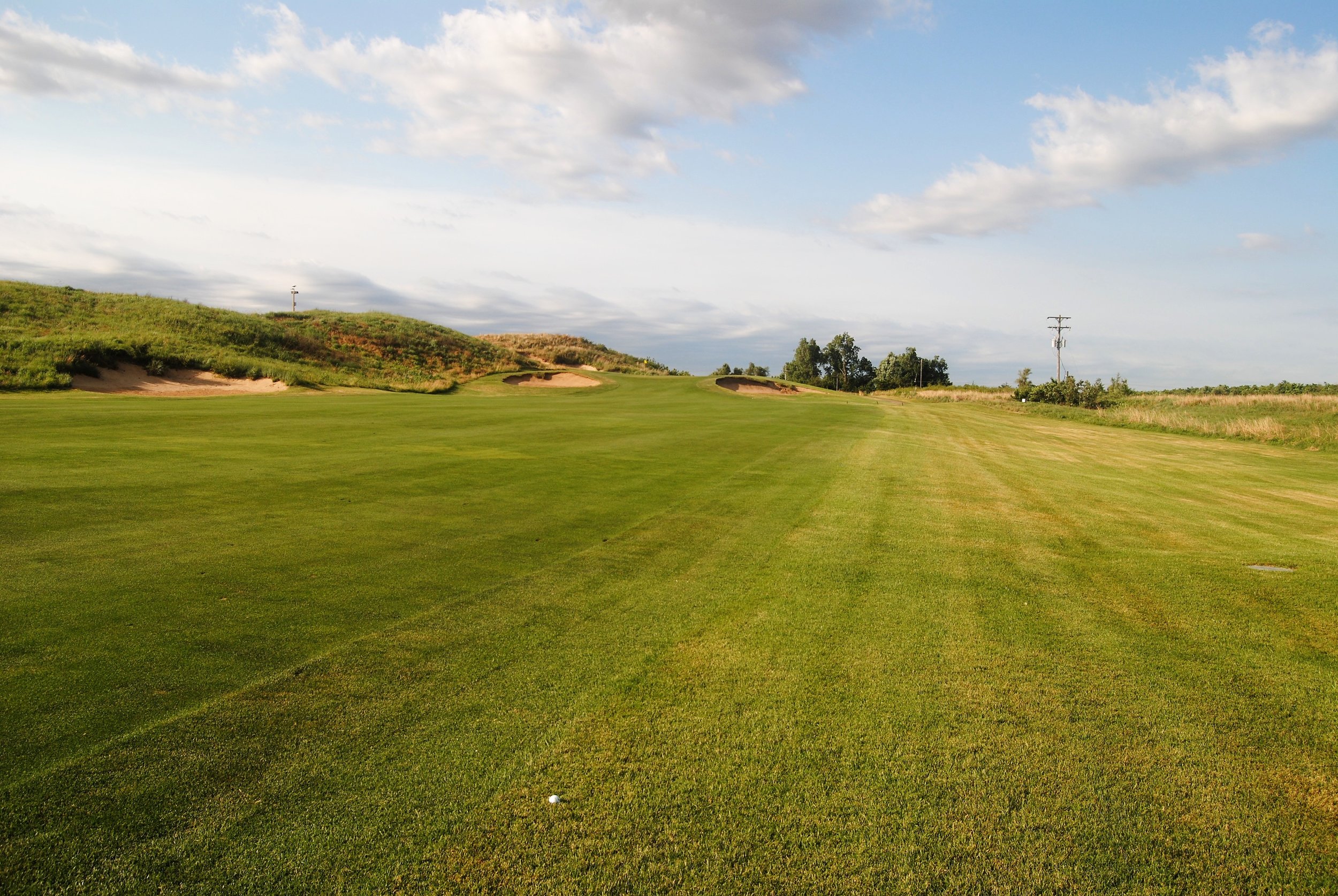 This is where my 5th hole tee shot ended up. I hit an 8 iron over that right front bunker. the ball ended up off the back of the green.