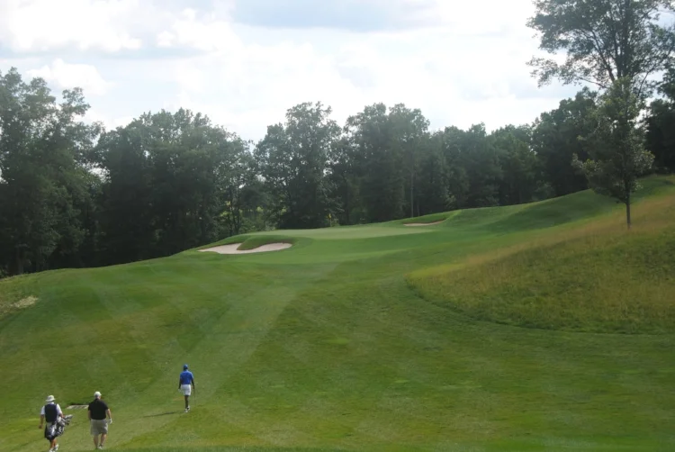 Richard, his caddie, and I head to the green on the 11th hole where I started to piece my game back together