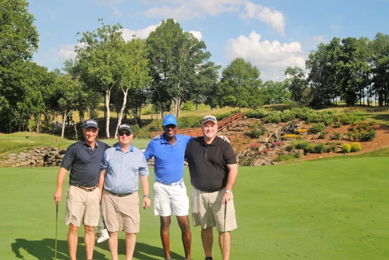 Kevin, James, me, and Richard in front of the 13th Green