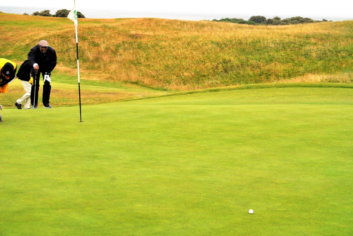 Reading the line with Colin for my birdie putt on the 7th hole