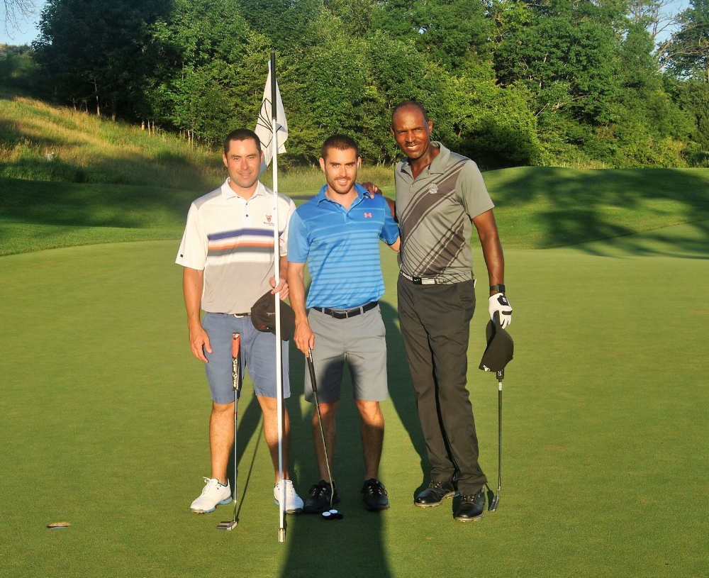 Alastair, Tom, and me following our round