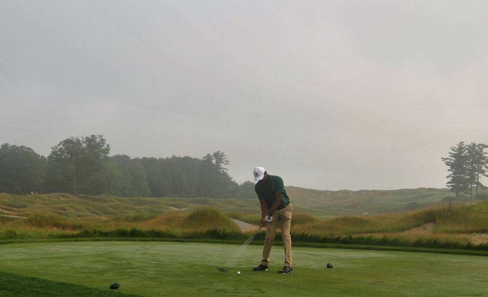 Teeing off on the first hole, into the mist