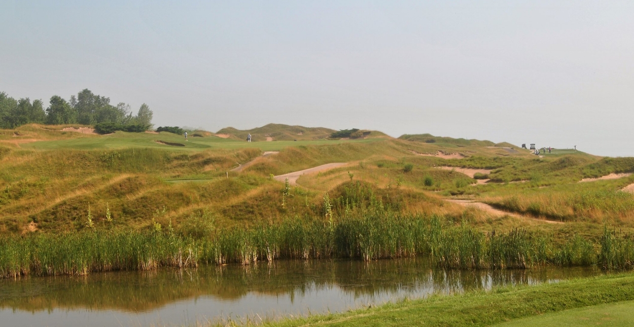 The sixth hole. The fairway is to the left. The green is over the bunkers that are left of the fairway.