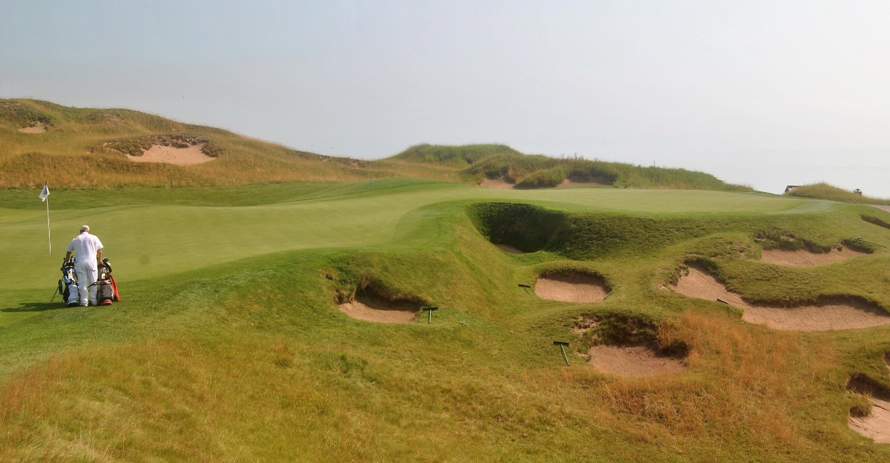 The sixth green. My approach shot landed 30 feet past the pin. The punishing bunker is the one cut into the middle of the green.