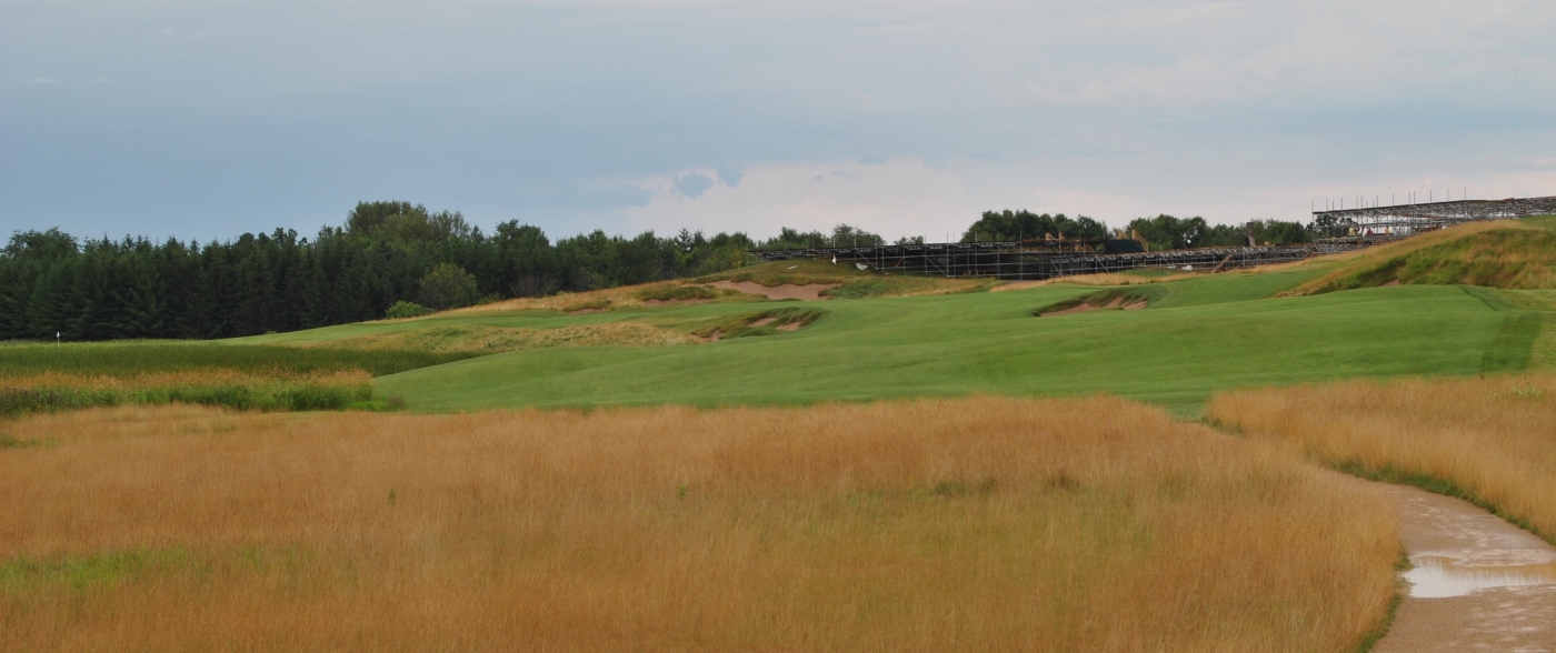 The Par 5 first hole. It doglegs left, the flag is the one on the far left edge of the picture. On the right of the picture there are still remnants of the US Open.