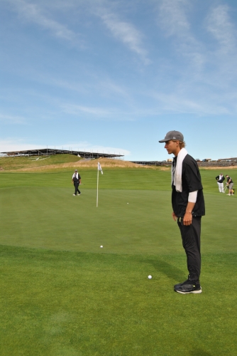 My approach shot rolled past the flag but stayed on the green. Mike is at the front of the green reading the line.