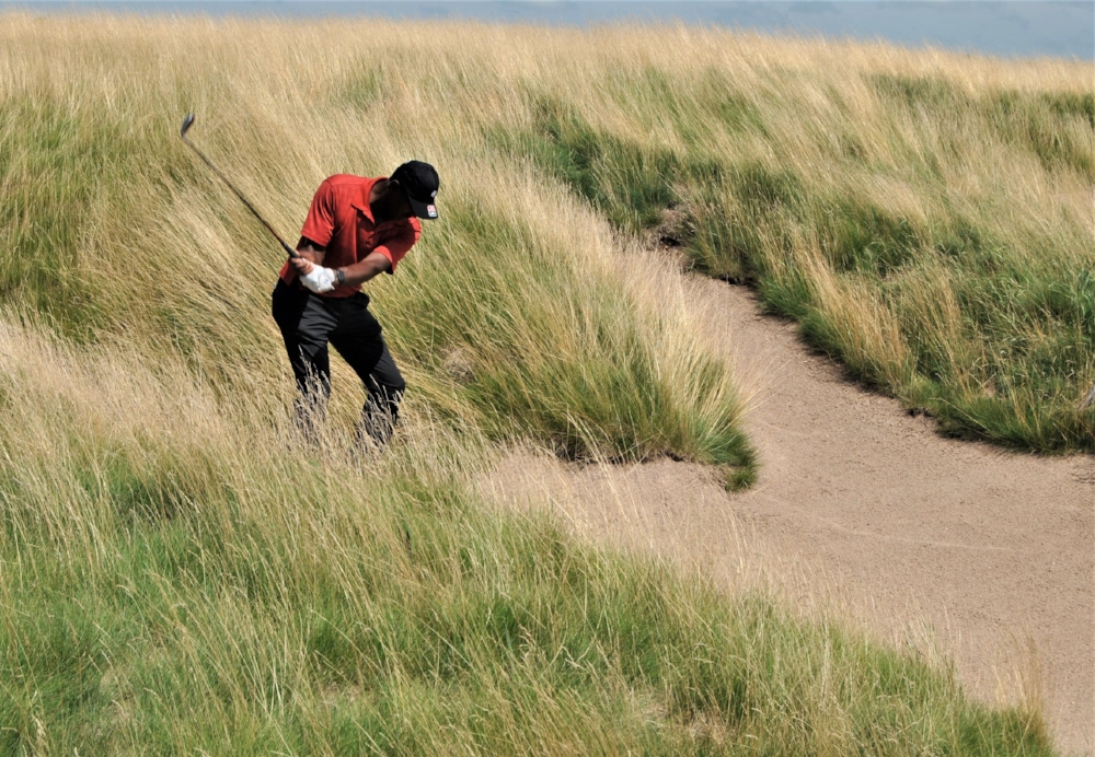 Hitting my third shot after my second shot on the 18 hole ended up in the bunker.