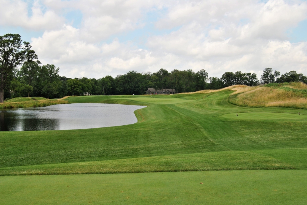 The Par 3 Seventeenth Hole. There is also water to the right of the fescue.