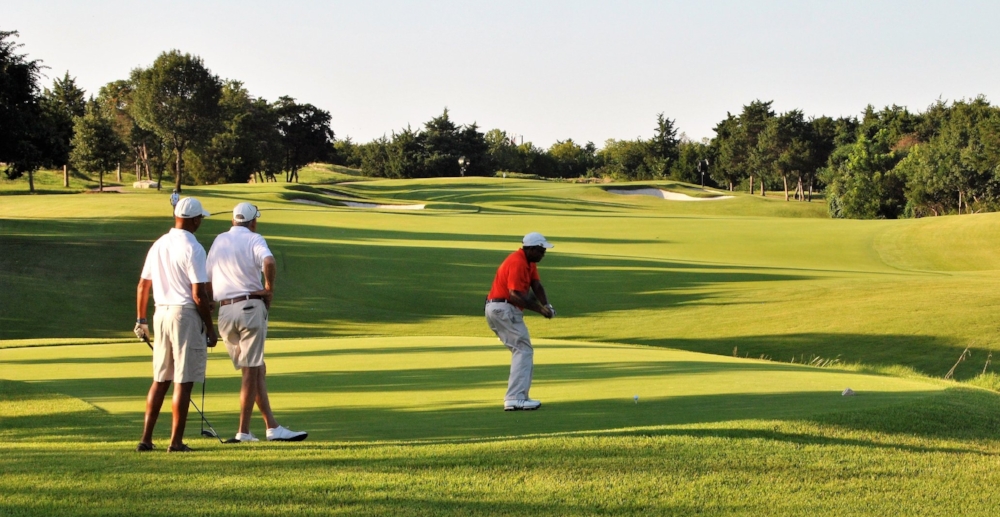 Dr. Gerald Bulloch leads the first group off the tee on the first hole.