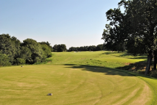By the seventh hole, we'd caught up with the maintenance crew putting sand on the tee boxes.
