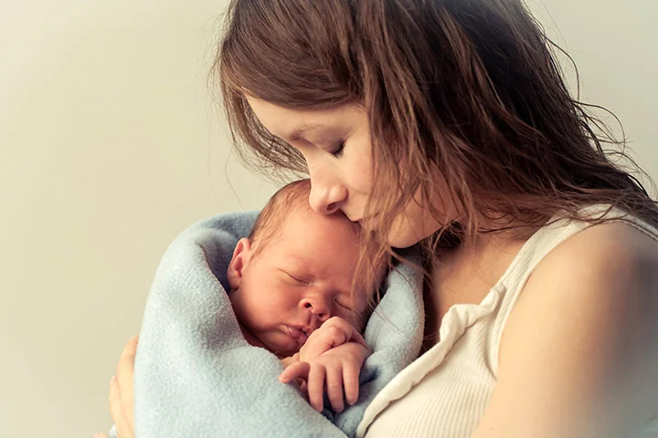 Little-Baby-Sleeping-In-Mother’s-Arms.jpg