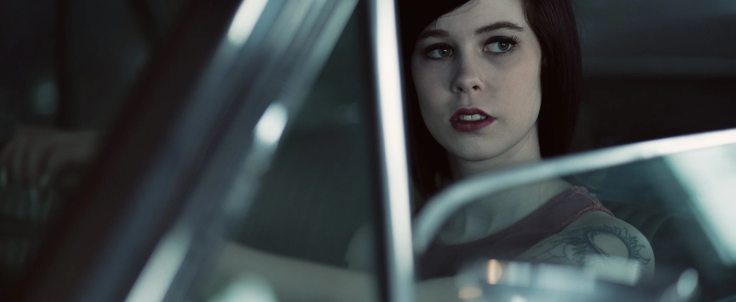 Trauma-counselling-and-therapy-Melbourne-Complex-PTSD-treatment-help-for-C-PTSD-Melbourne-young-woman-in-car-seen-through-window