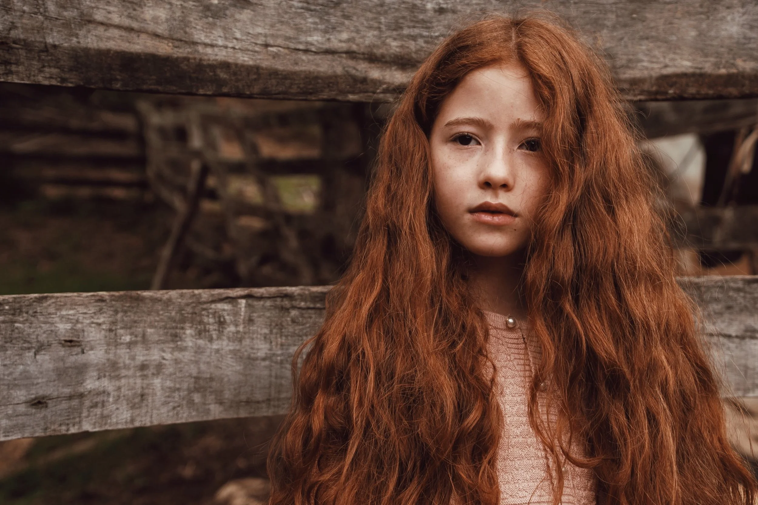 teen-counselling-Melbourne-Amanda-Robins-Psychotherapy-girl-with-long-red-hair-leaning-against-a-fence