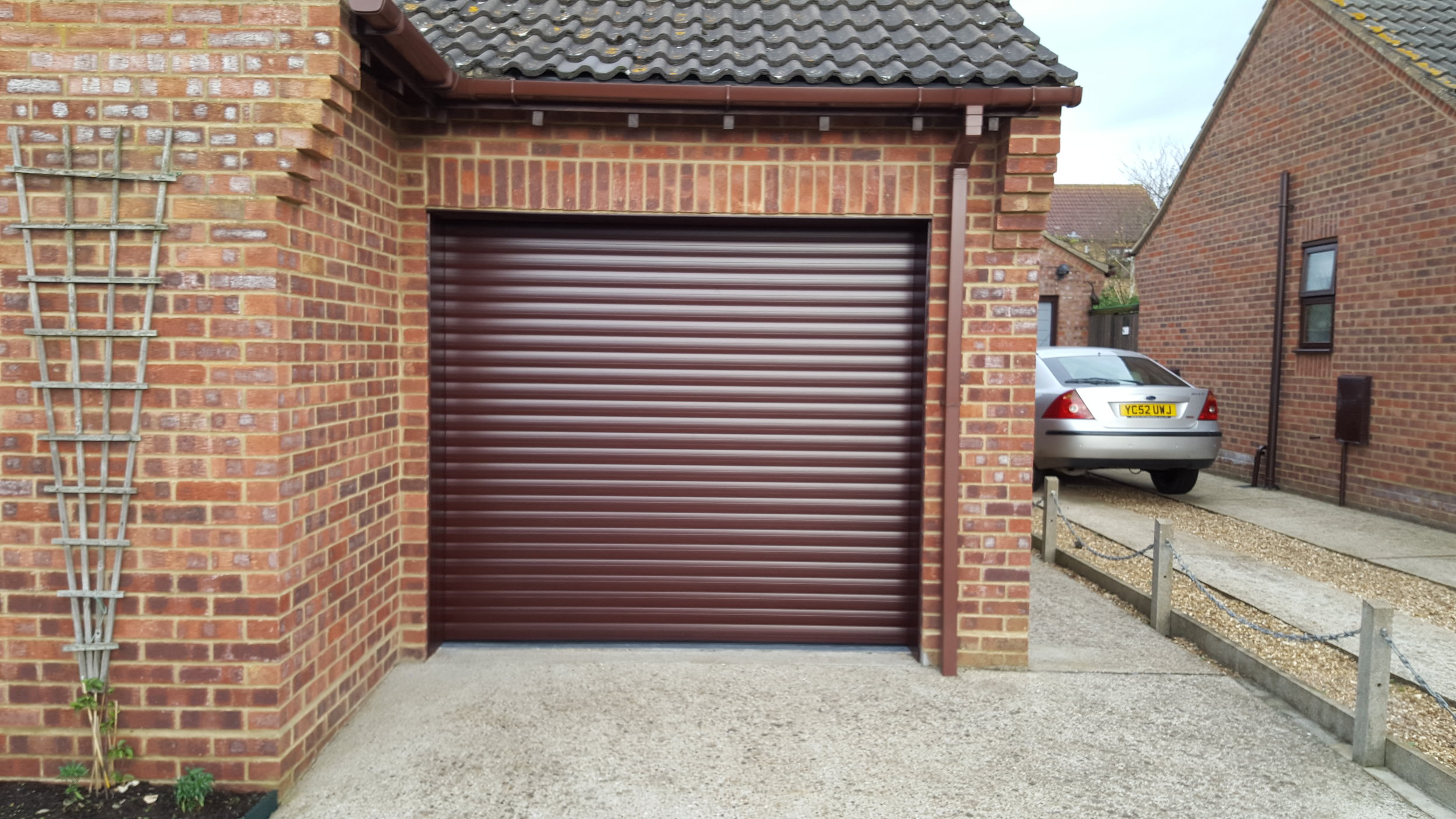 Roller shutter style garage doors