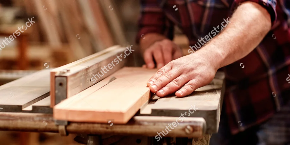 stock-photo-cropped-image-of-the-hands-of-a-skilled-craftsman-cutting-a-wooden-plank-with-a-circular-saw-in-a-382064143-WEB.jpg