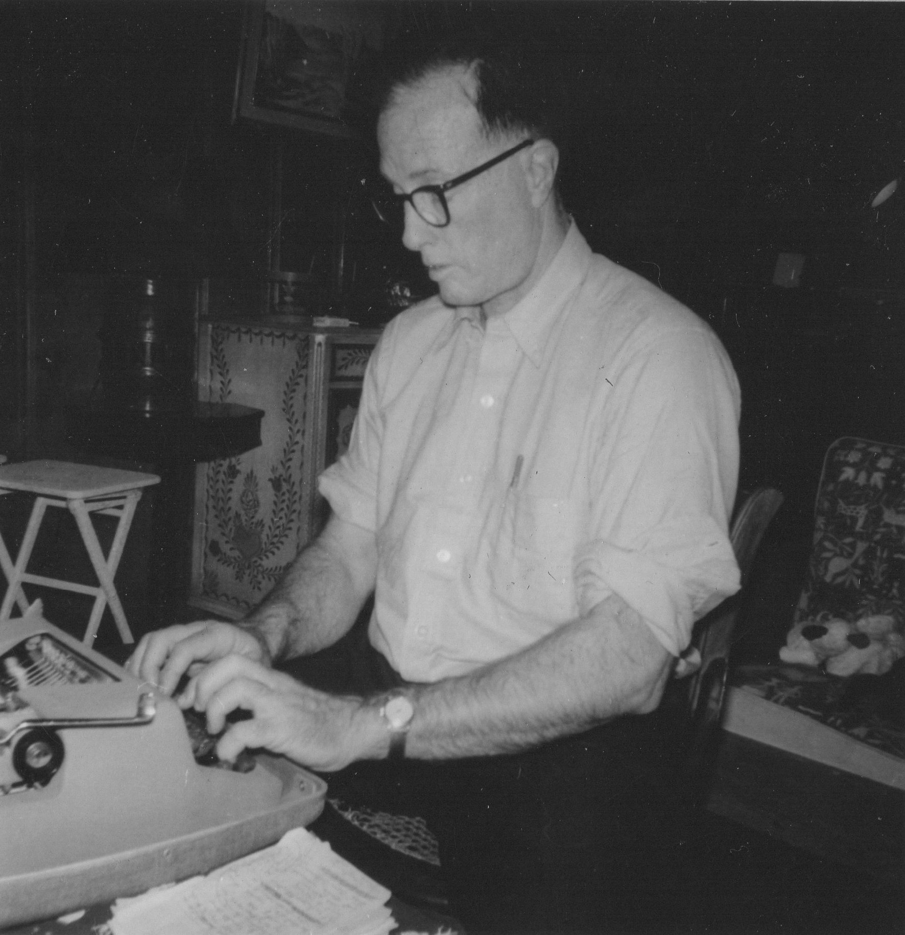 John at work typing lyrics to the songs he sang.