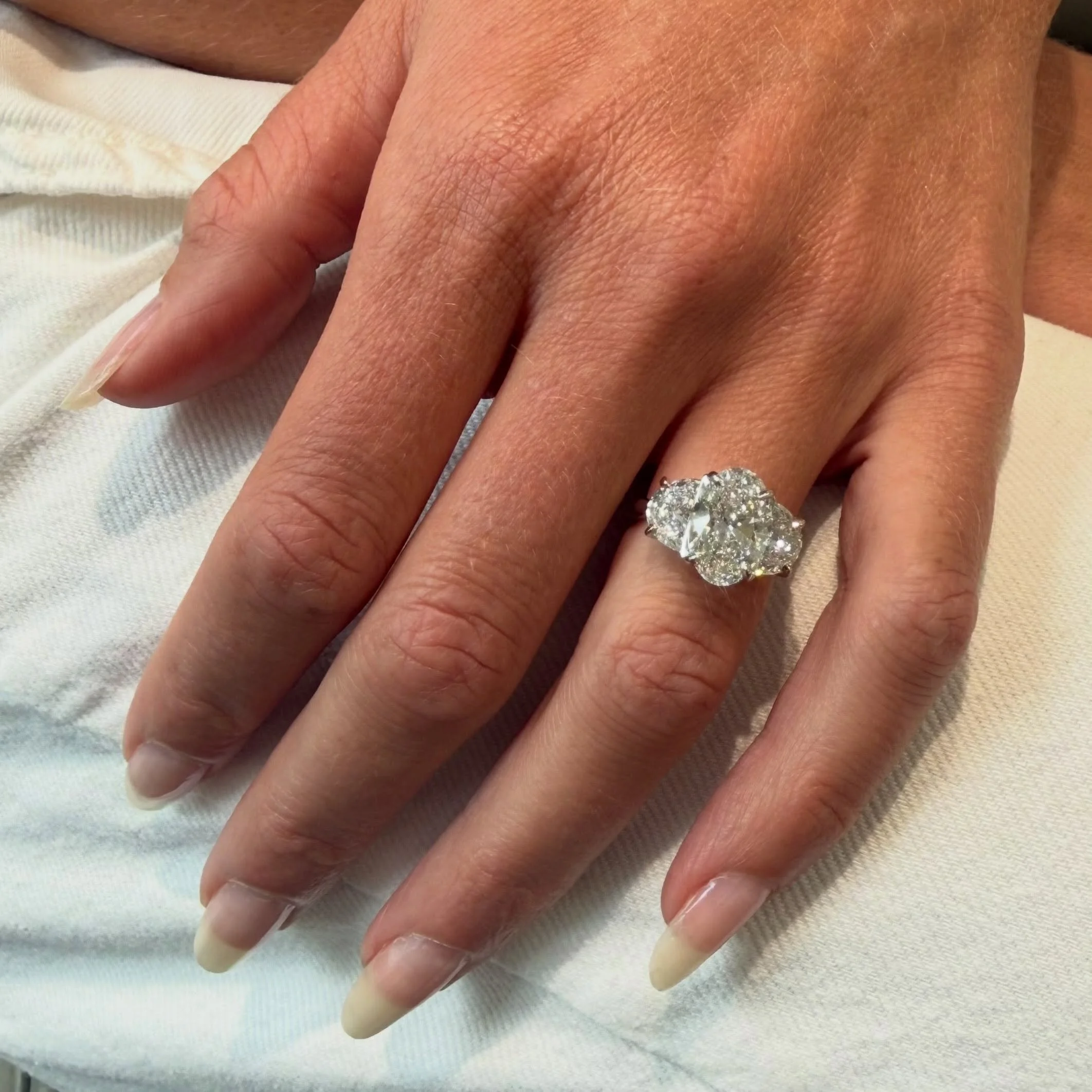This ring! 
One of our latest custom designs, featuring a 3ct oval center and 1ct half moon shapes on each side in platinum. 💍