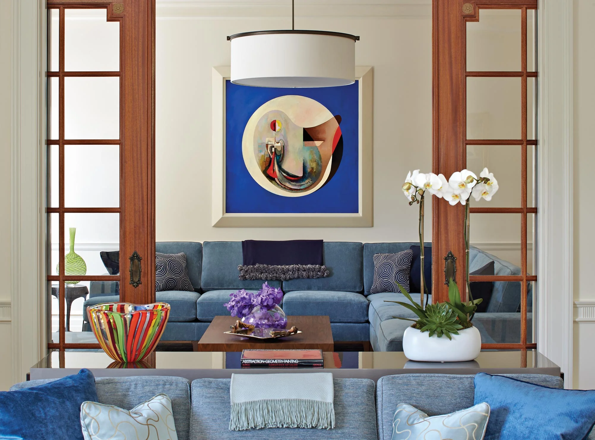 A large work by Theodore Roszak provides a playful focus to the Family Room, seen from the Living Room.