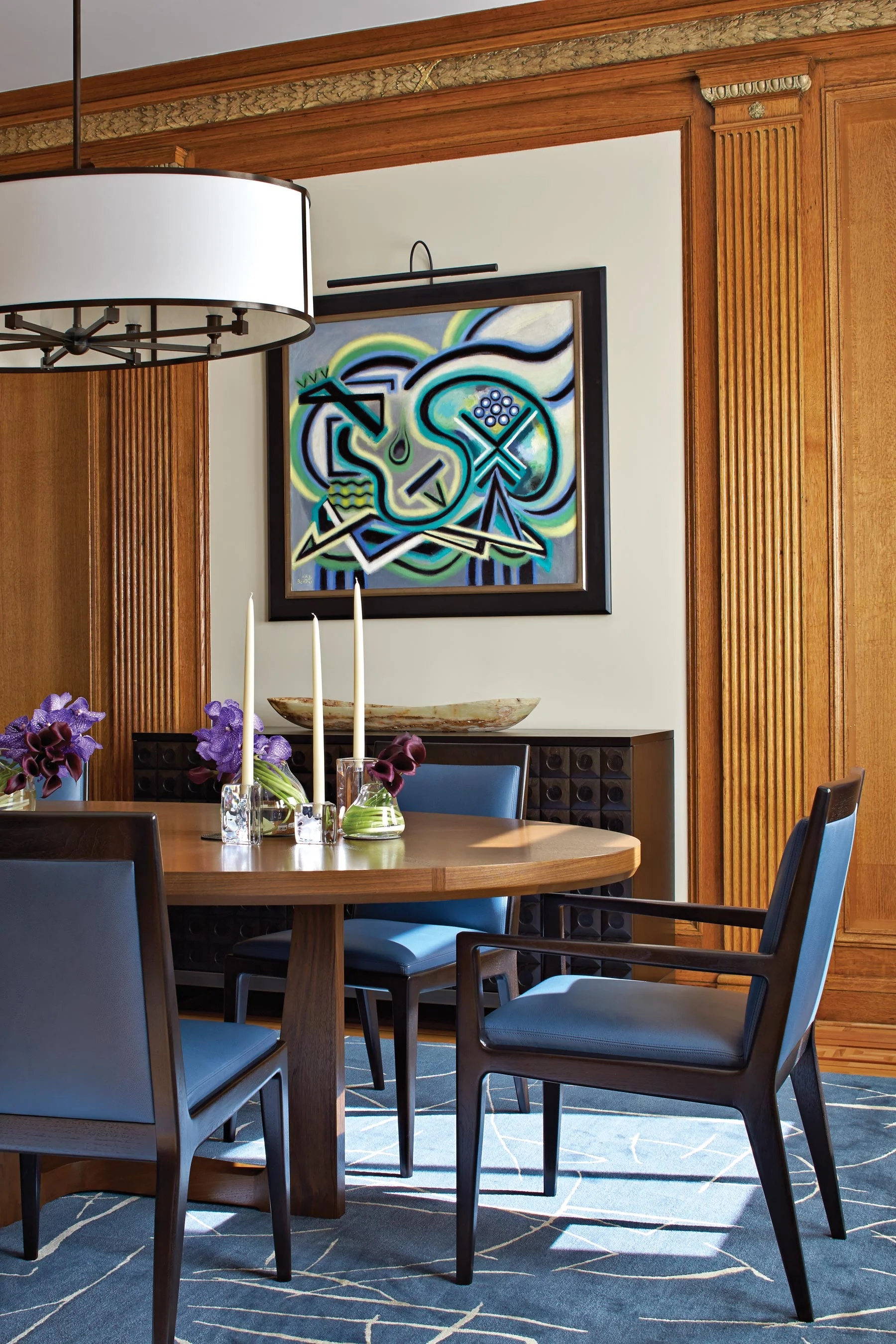 The crisp blue palette of the Dining Room complements the original carved & gilded oak paneling.