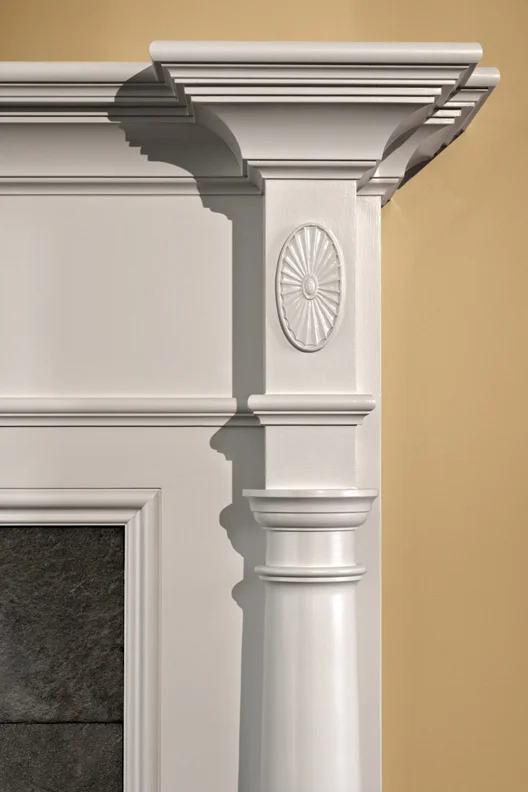 The detailing of the new mantlepiece recalls the classic lines of the original house.
