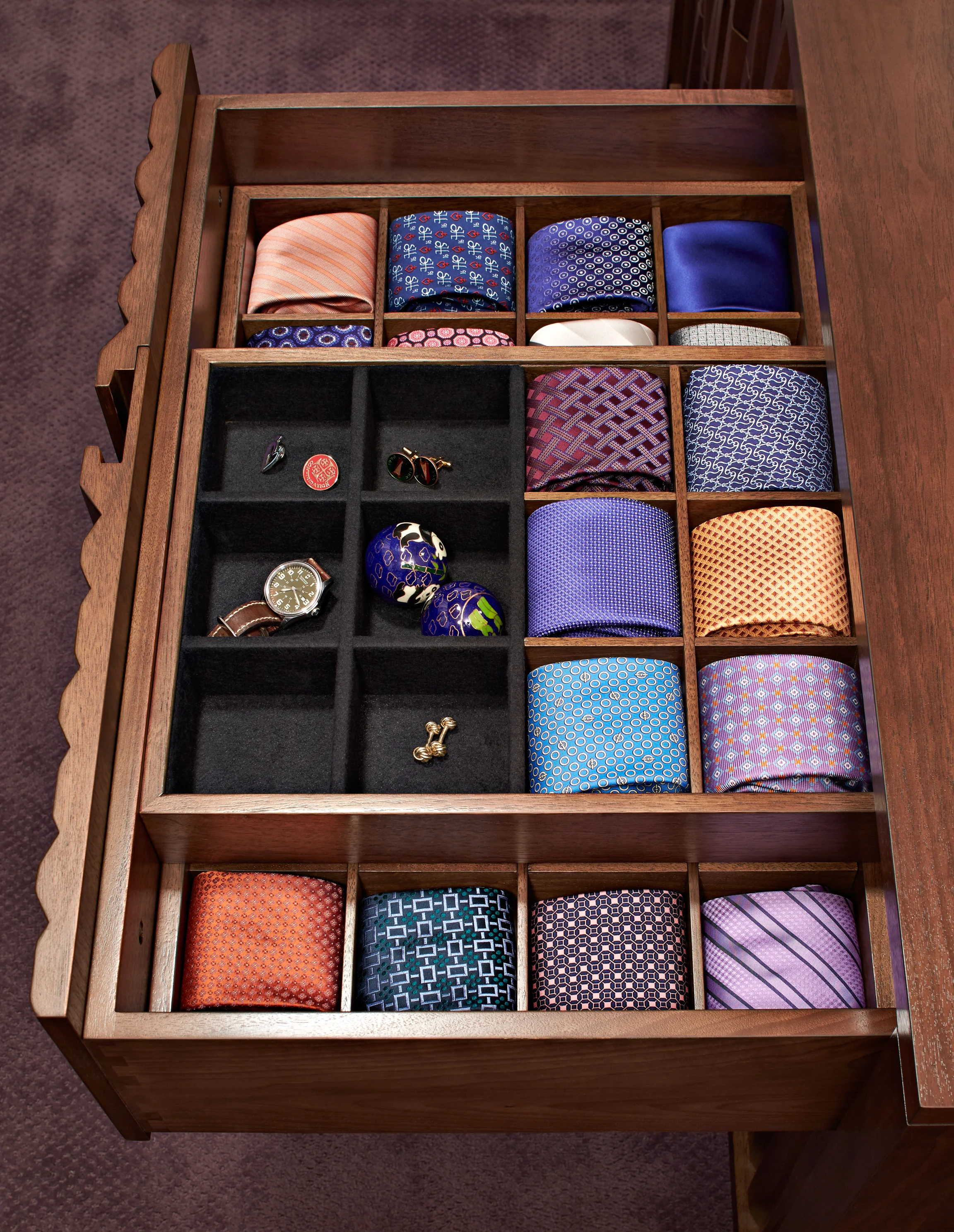 Neck ties are neatly stored in this custom-designed drawer.