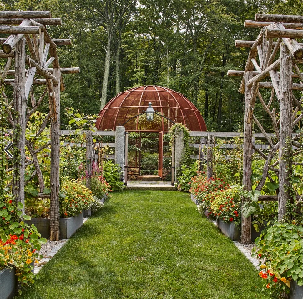 The domed Berry Bowl provides a unique terminus to the garden's center pathway.