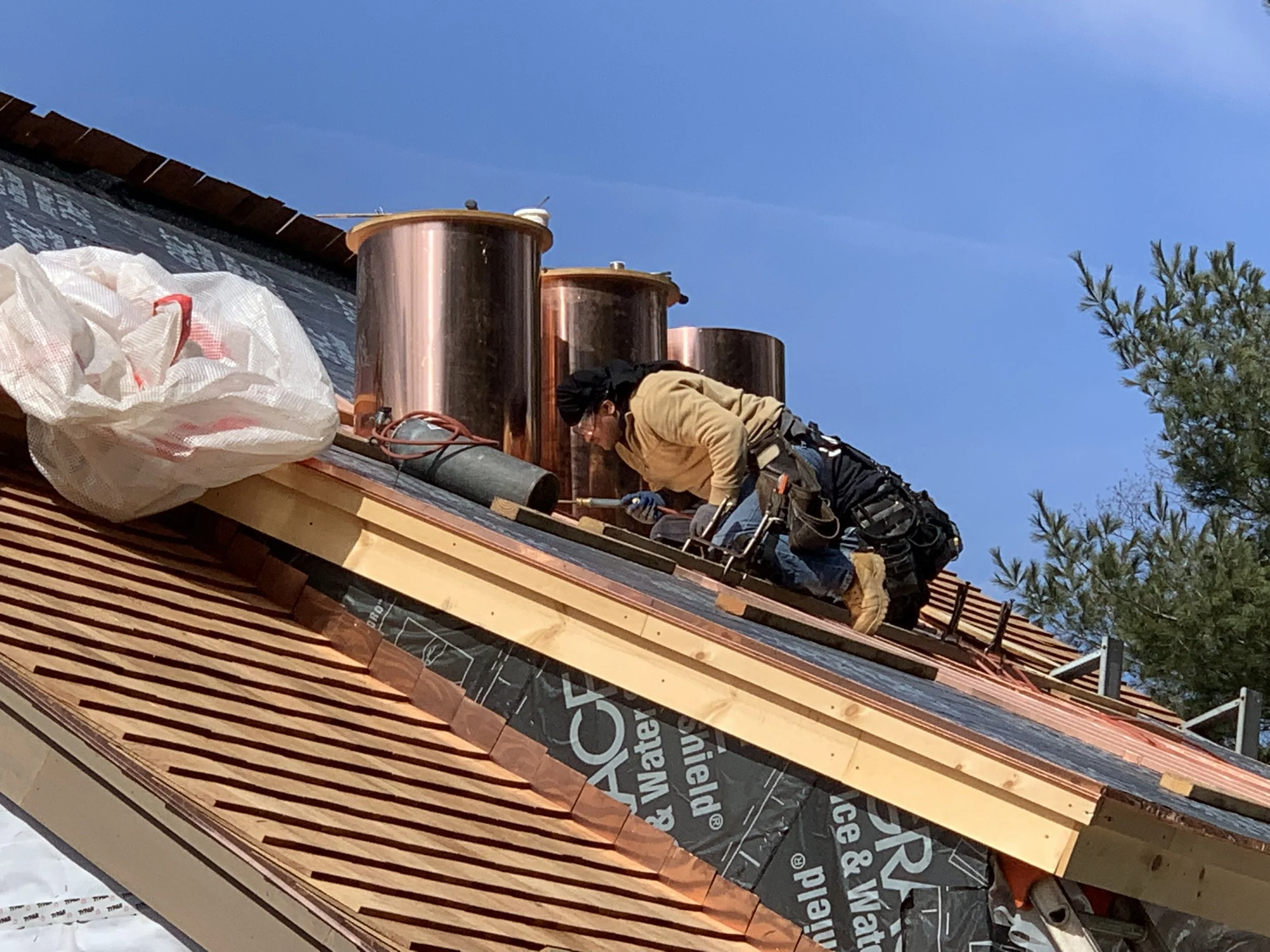 The three cylindrical copper chimneys begin to take shape.