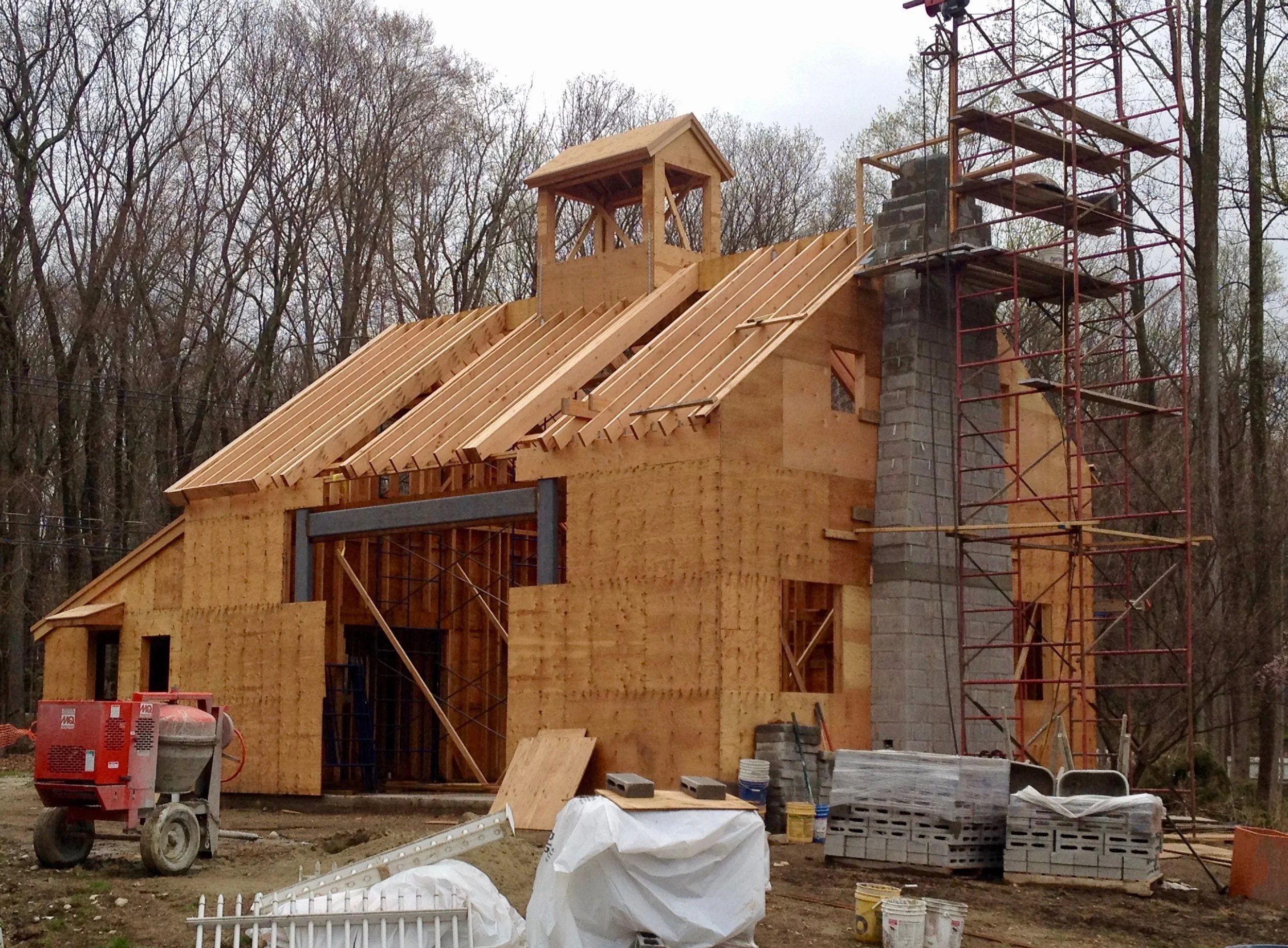 This in-progress view shows the steel framing which will support the massive central sliding pocket doors.