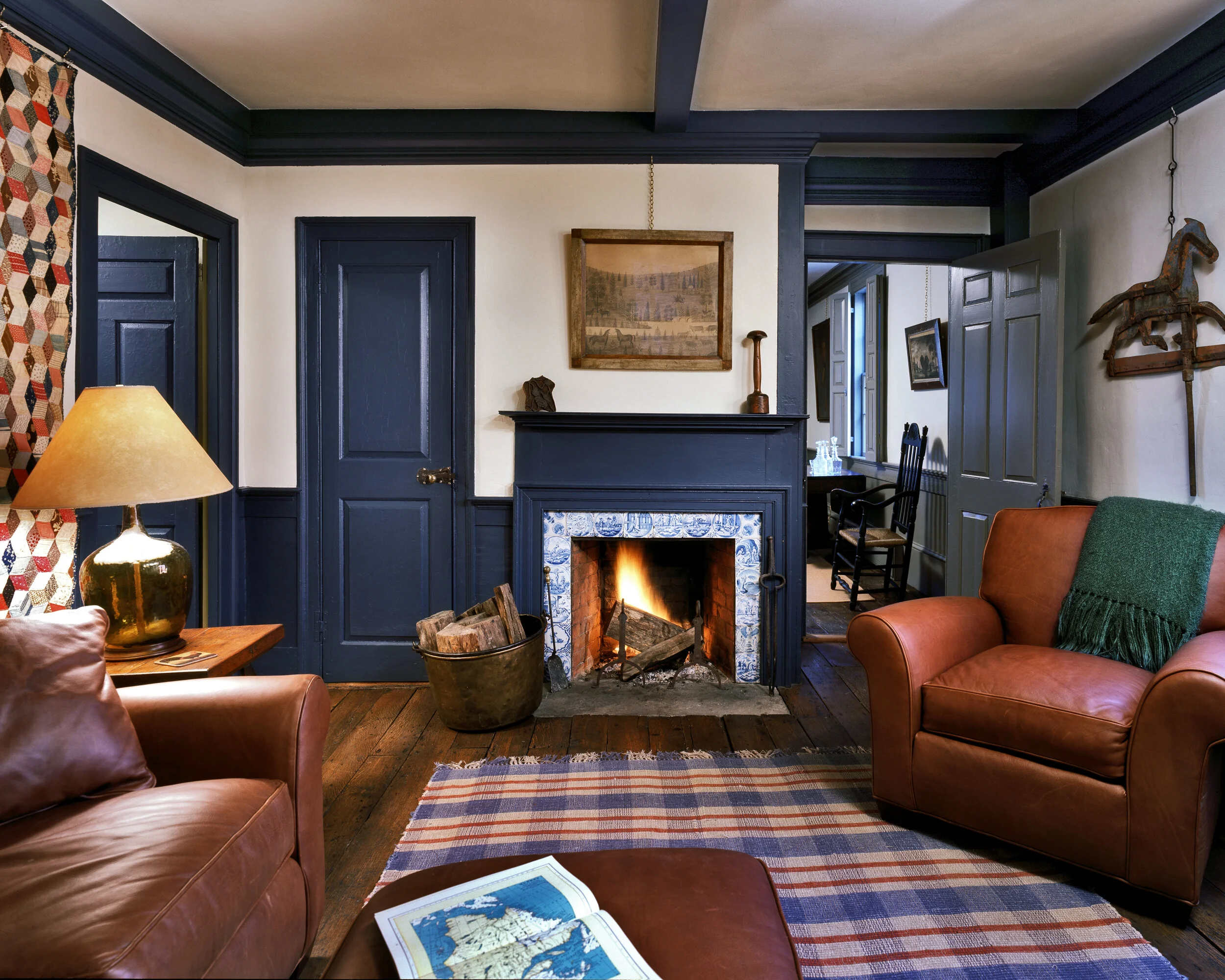 The colors of the Family Room are inspired by the antique Delft tiles surrounding the fireplace.