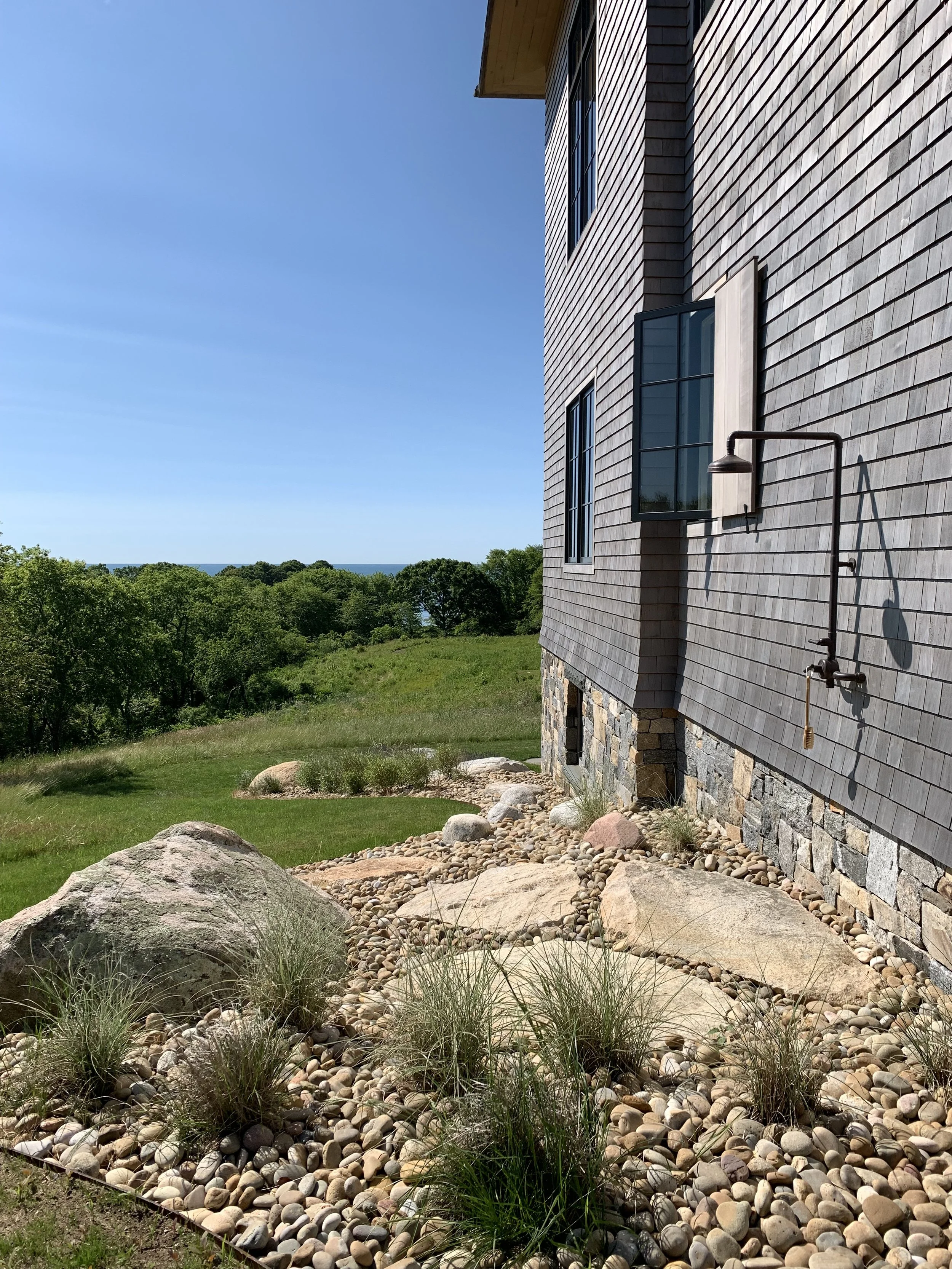 These huge natural granite pavers found on the site are perfect for the outdoor shower.