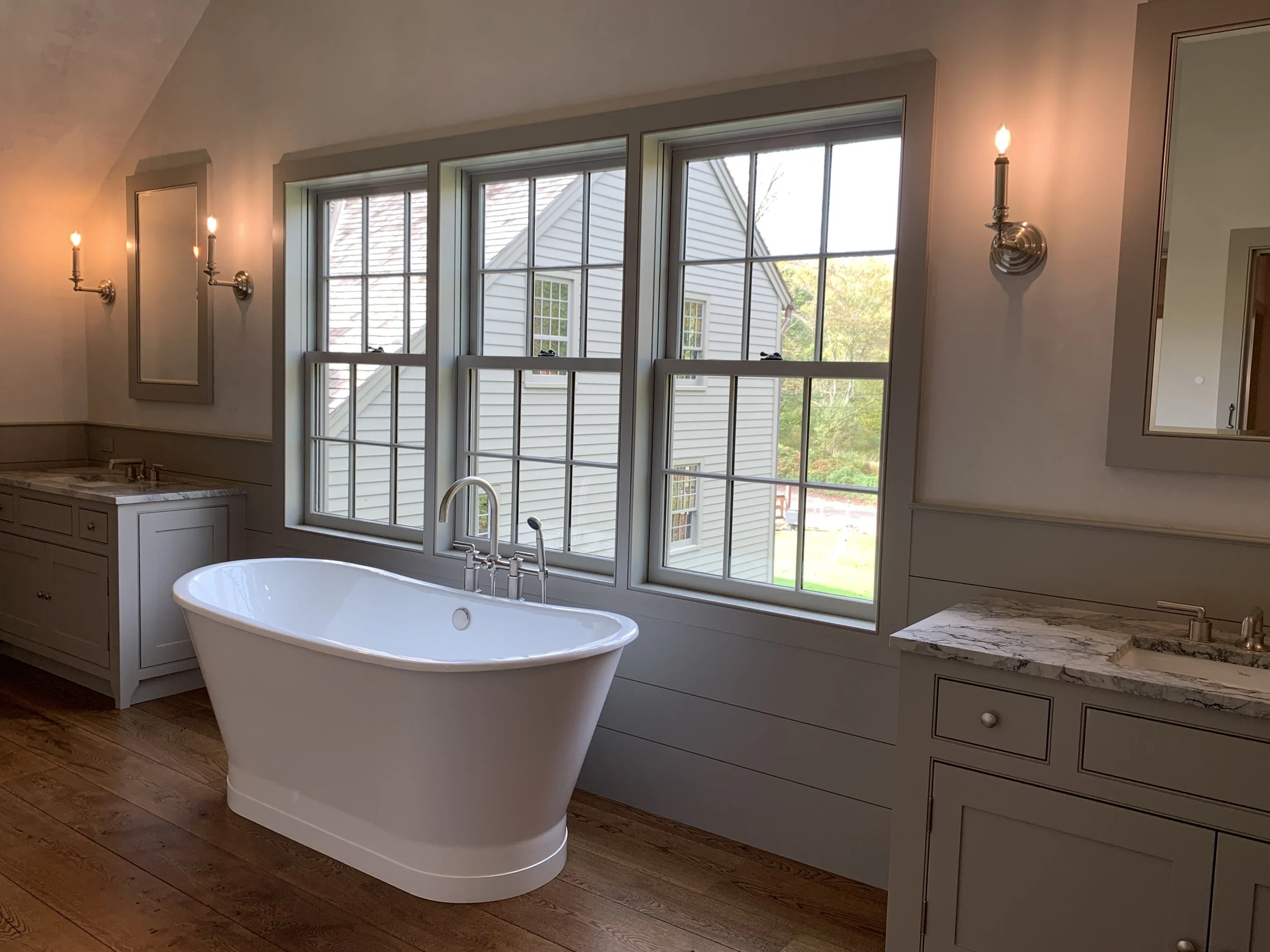 The soaking tub in the Primary Bathroom affords views of the surrounding farmland.