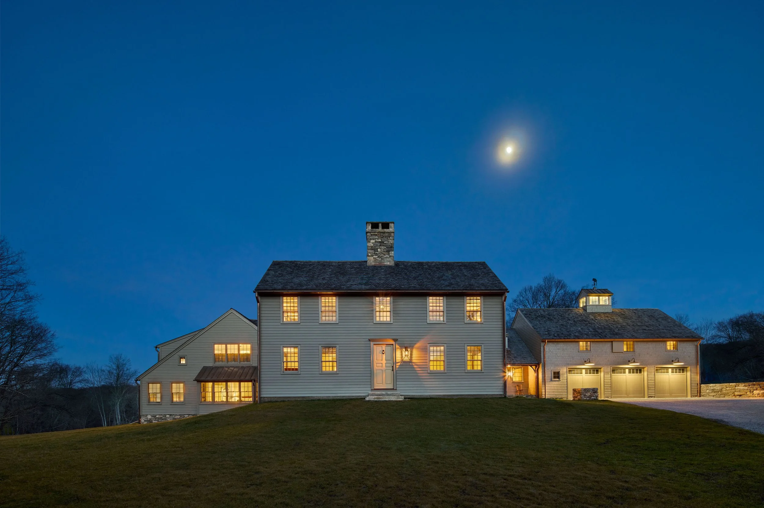  The placement of the new additions, to the rear of the property, gives prominence to the original antique house. 