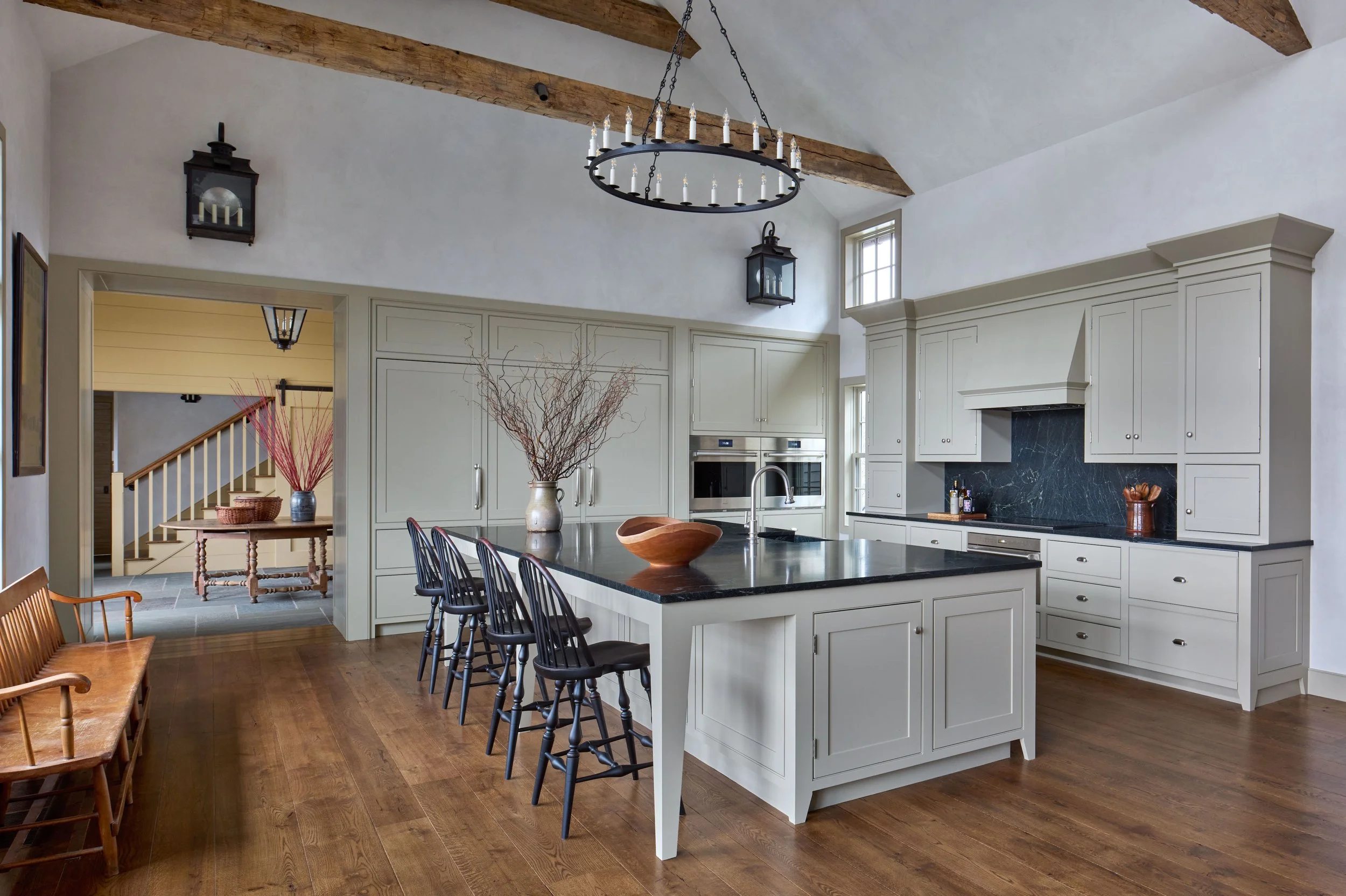  The simple cabinetry of the Kitchen section of the new Great Room is inspired by country furnishings of the period. 