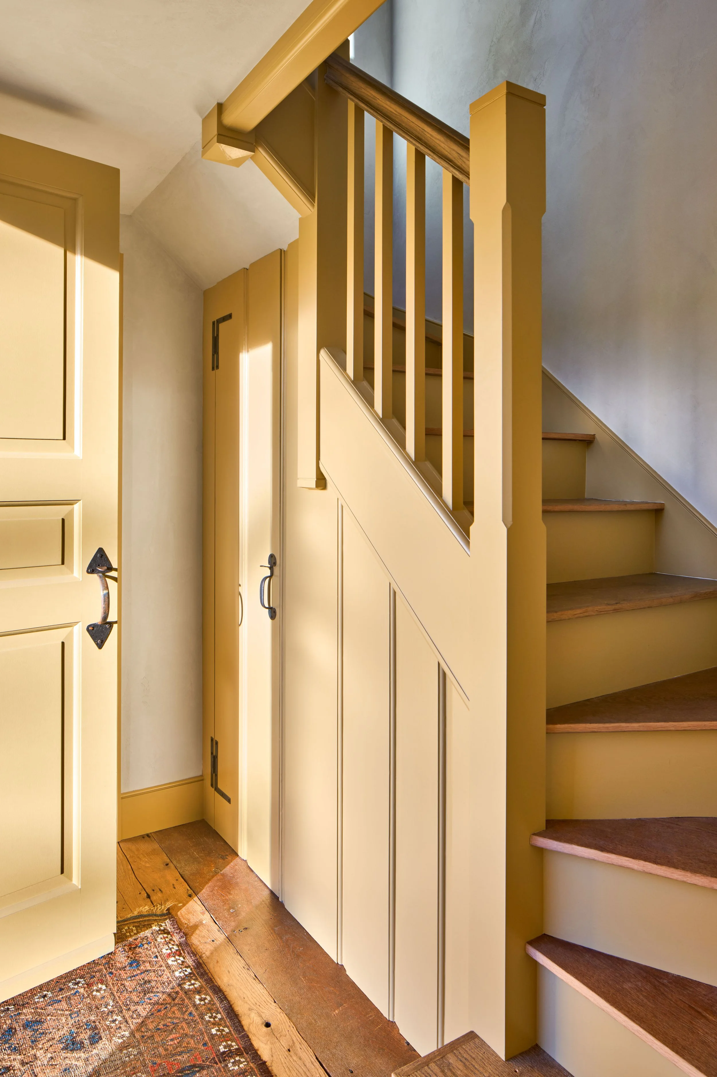  The reconstructed winding stair, paneling and entry door of the original house are inspired by local 18th century examples. 