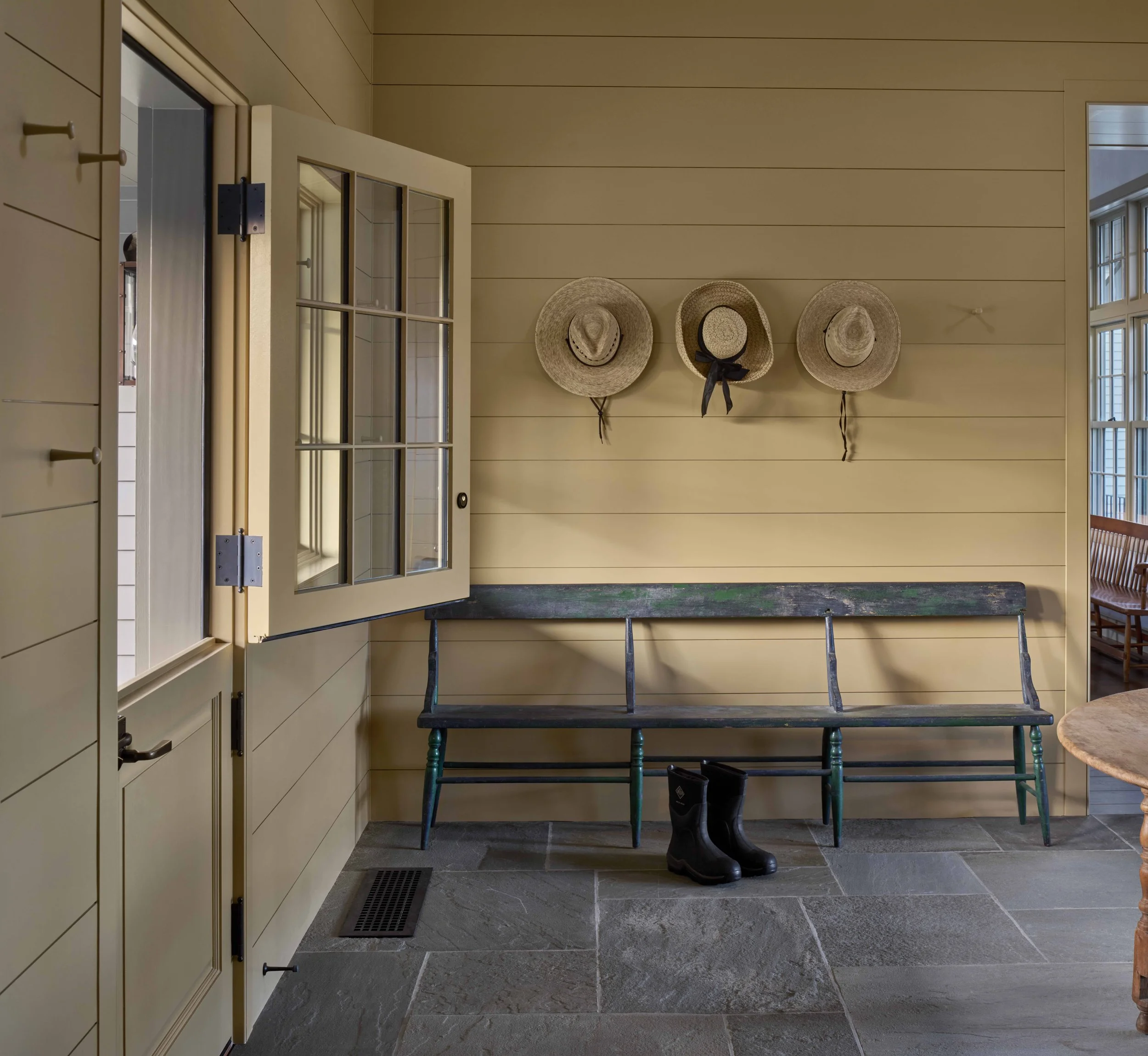  A Dutch door serves as the main family entrance to the new Mud Room. 