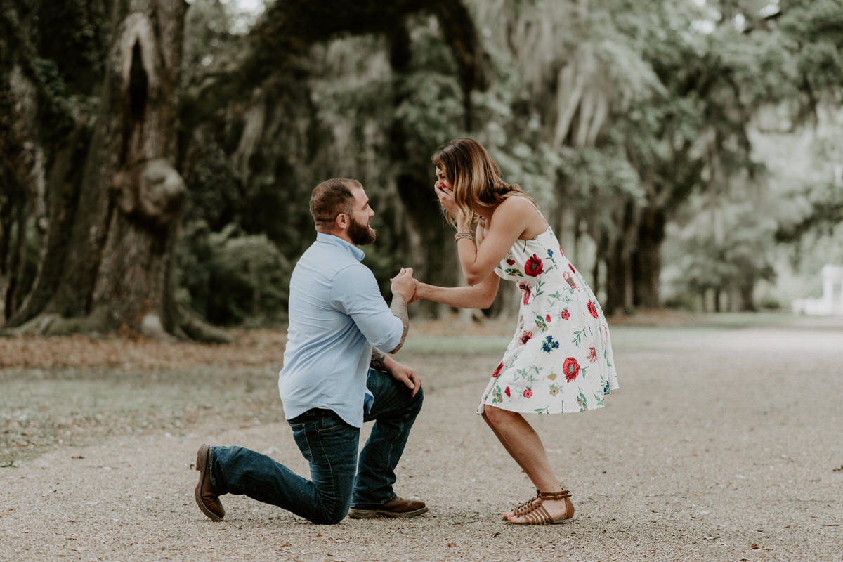 Sweet family and surprise proposal session in st. francisville, louisiana at rosedown plantation with gorgeous oak trees photographed by magnolia and grace photography