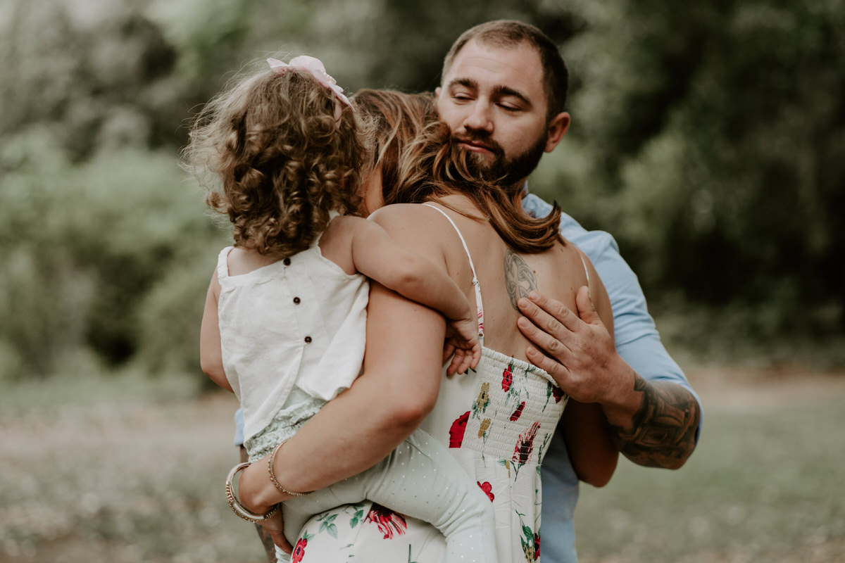 Sweet family and surprise proposal session in st. francisville, louisiana at rosedown plantation with gorgeous oak trees photographed by magnolia and grace photography