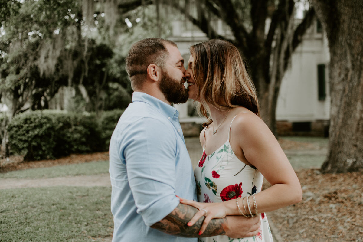 Sweet family and surprise proposal session in st. francisville, louisiana at rosedown plantation with gorgeous oak trees photographed by magnolia and grace photography