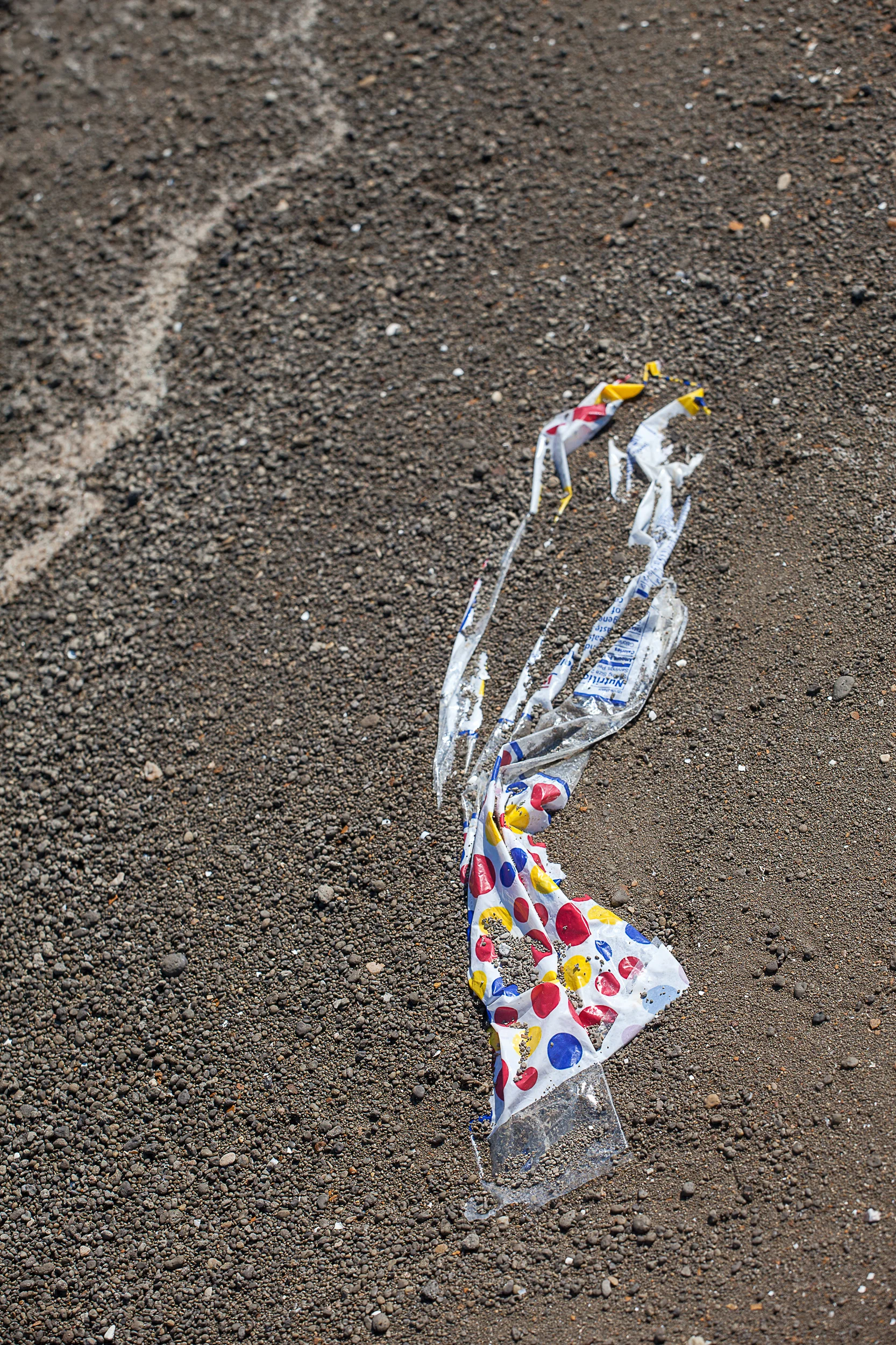 Wonder-Bread-Bag-Partially-Buried-In-Pebbly-Mud-Sel-Fo_64224.jpg