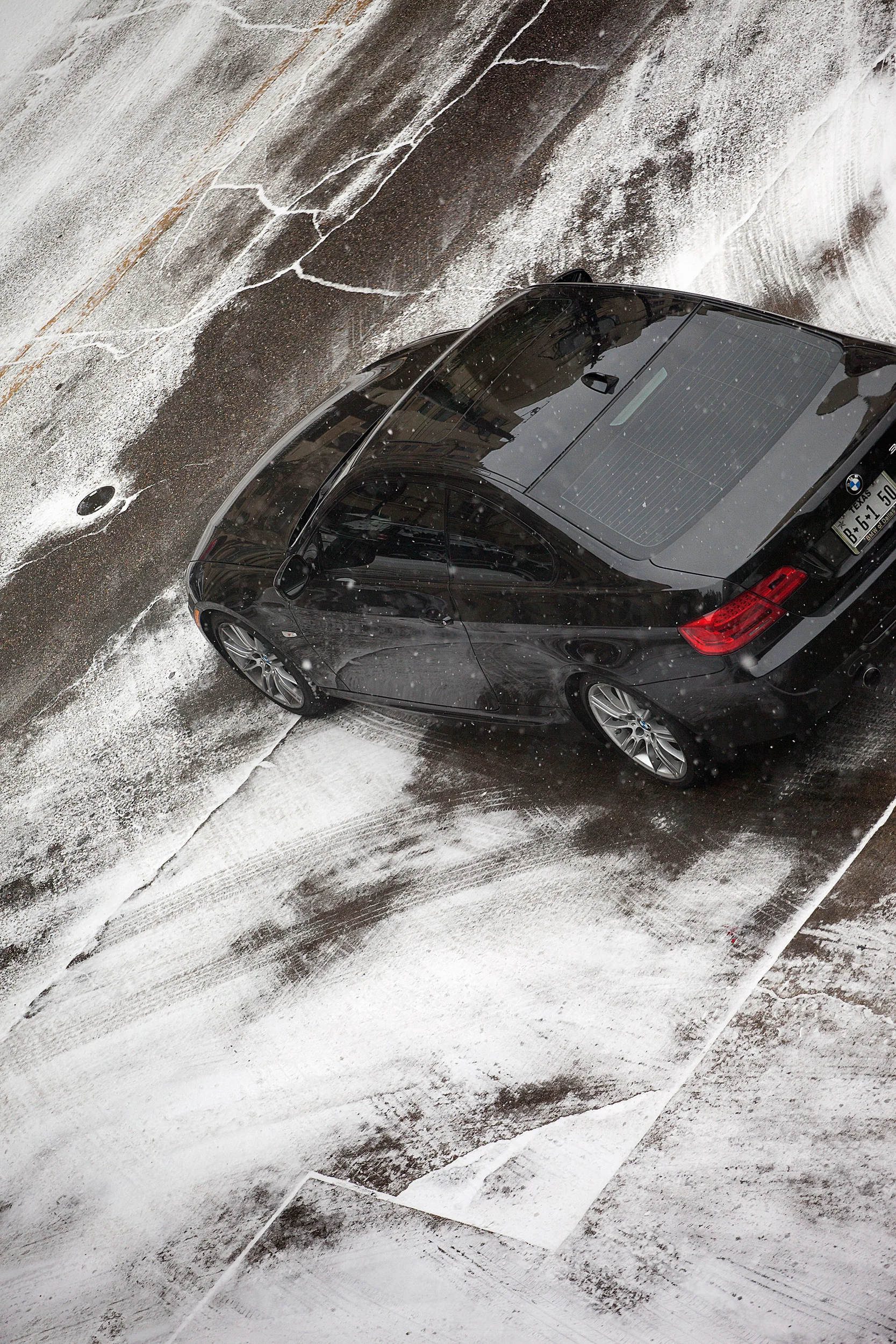 BMW-Pulling-Out-Of-Snow-Covered-Drive-From-Studio-Window_48623.jpg