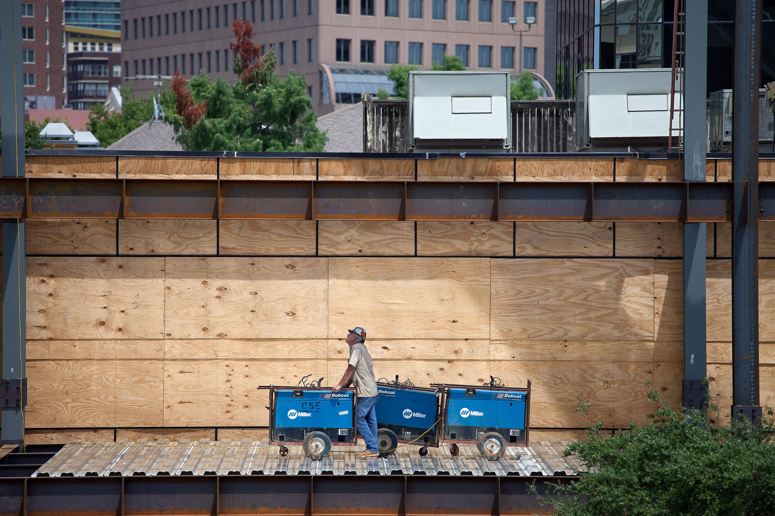 Construction-Worker-Leaning-On-Welders-W-Building_34490.jpg