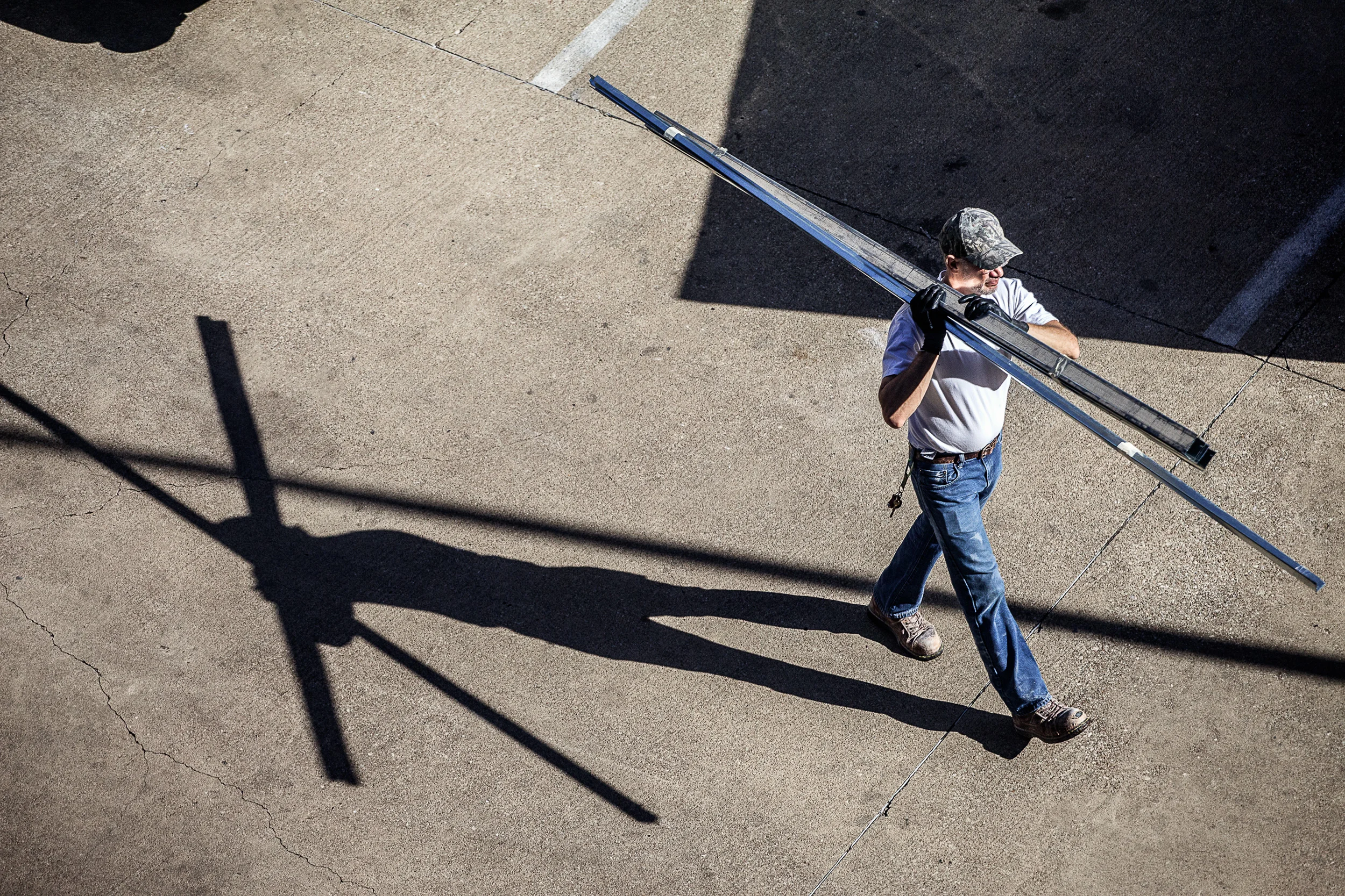 Man-In-White-Tee-W-Camo-Hat-W-Studs-On-His-Shoulder-Sharp-From-Studio-Window_106053.jpg