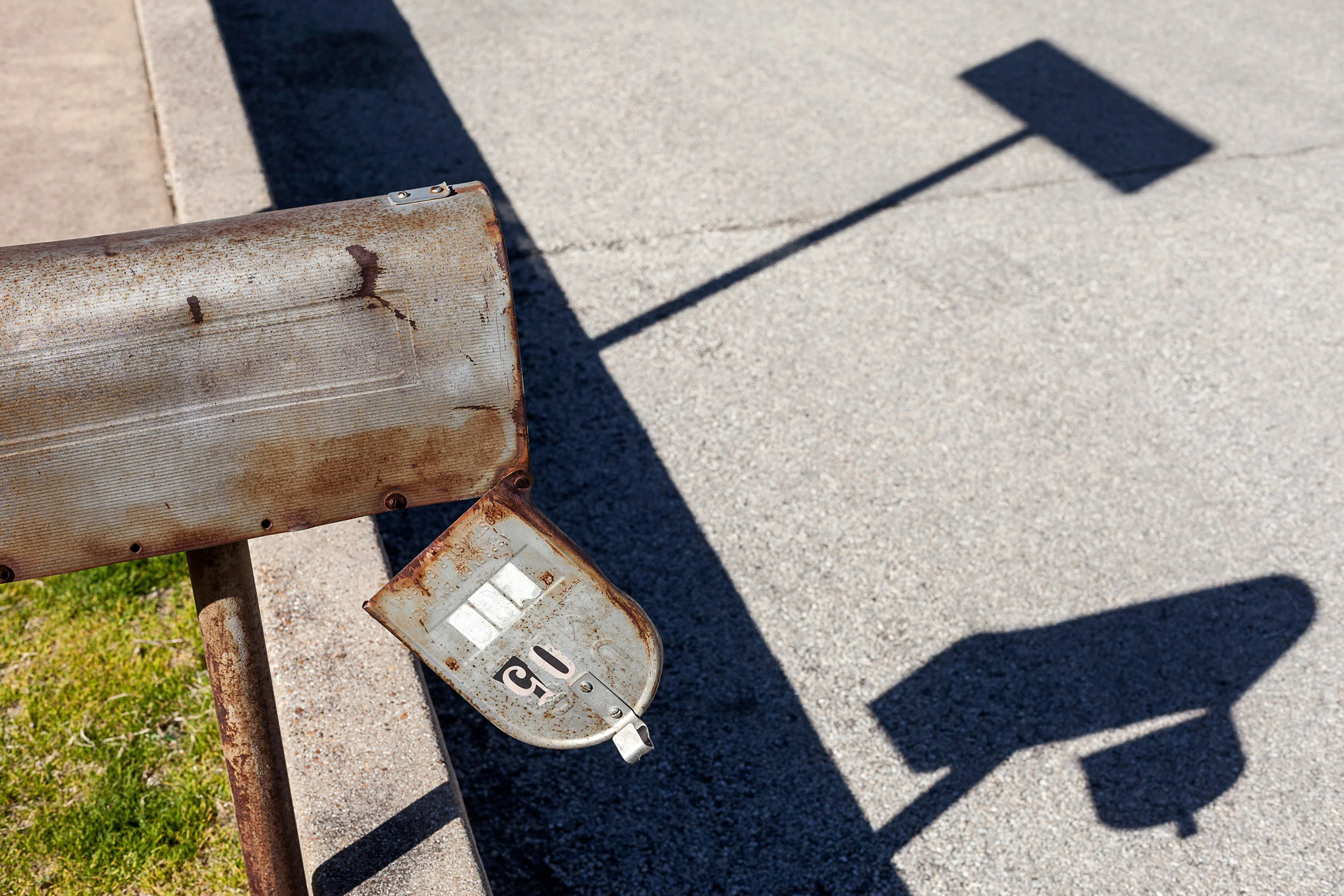 Rusty-Mailbox-W-Hanging-Door-Shadows-Near-Grapevine-Trains_83568.jpg