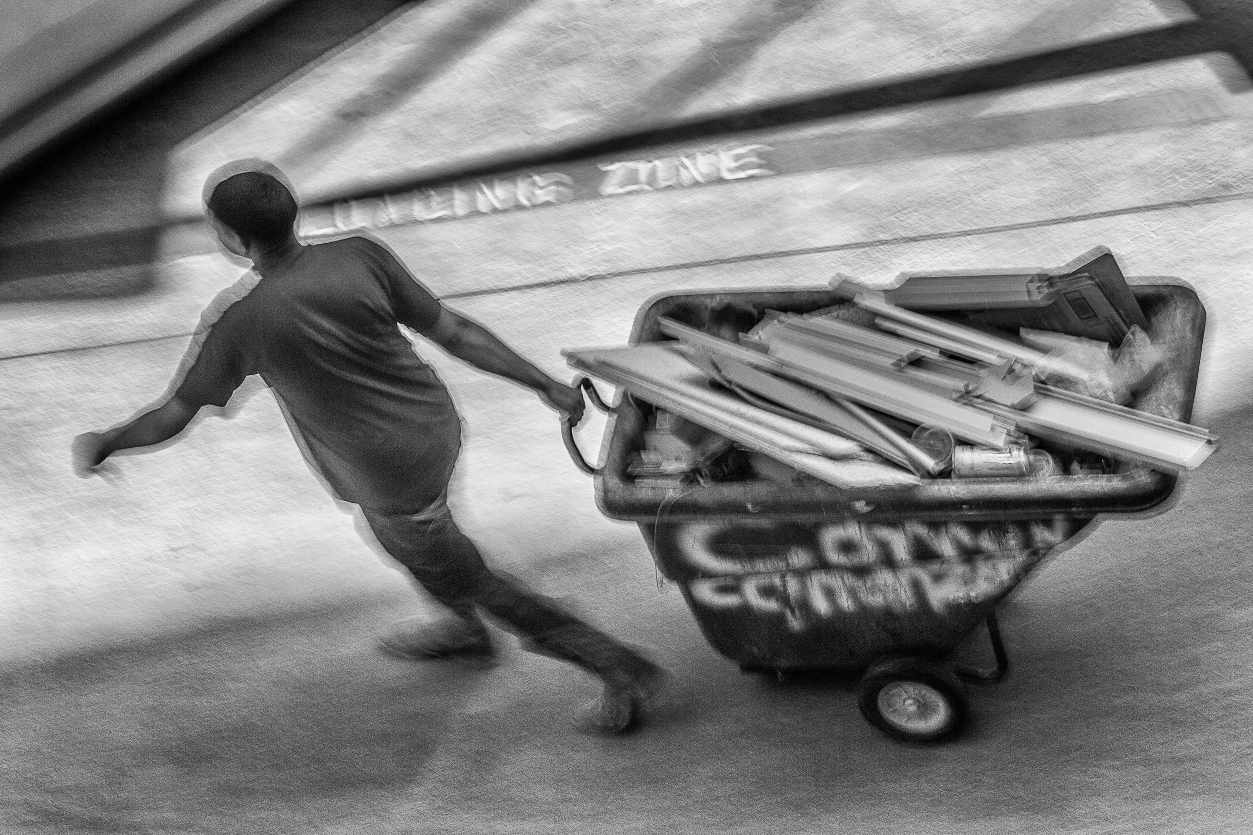 Man-In-Red-W-Full-Bin-Near-Load-Zone-W-Dumpster-From-Studio-Window-BW_92912.jpg