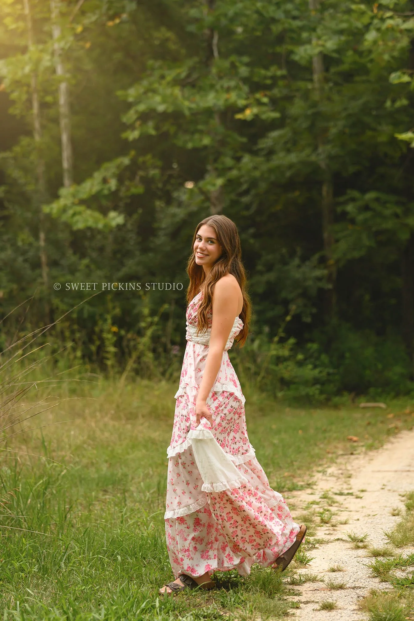 Taylor | Indiana Senior Girl Photography for class of 2027 senior in grass field wearing pink floral maxi dress at sunset by Sweet Pickins Studio senior photographer Amanda Wilson ©