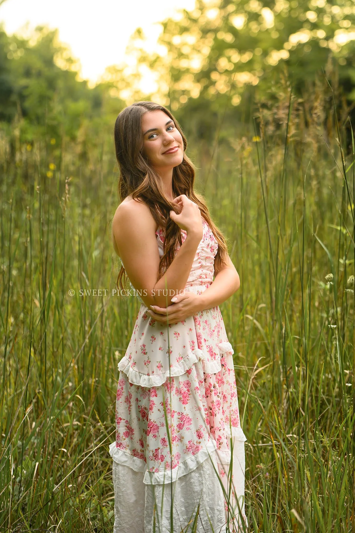 Taylor | Indiana Senior Girl Photography for class of 2027 senior in grass field wearing pink floral maxi dress at sunset by Sweet Pickins Studio senior photographer Amanda Wilson ©
