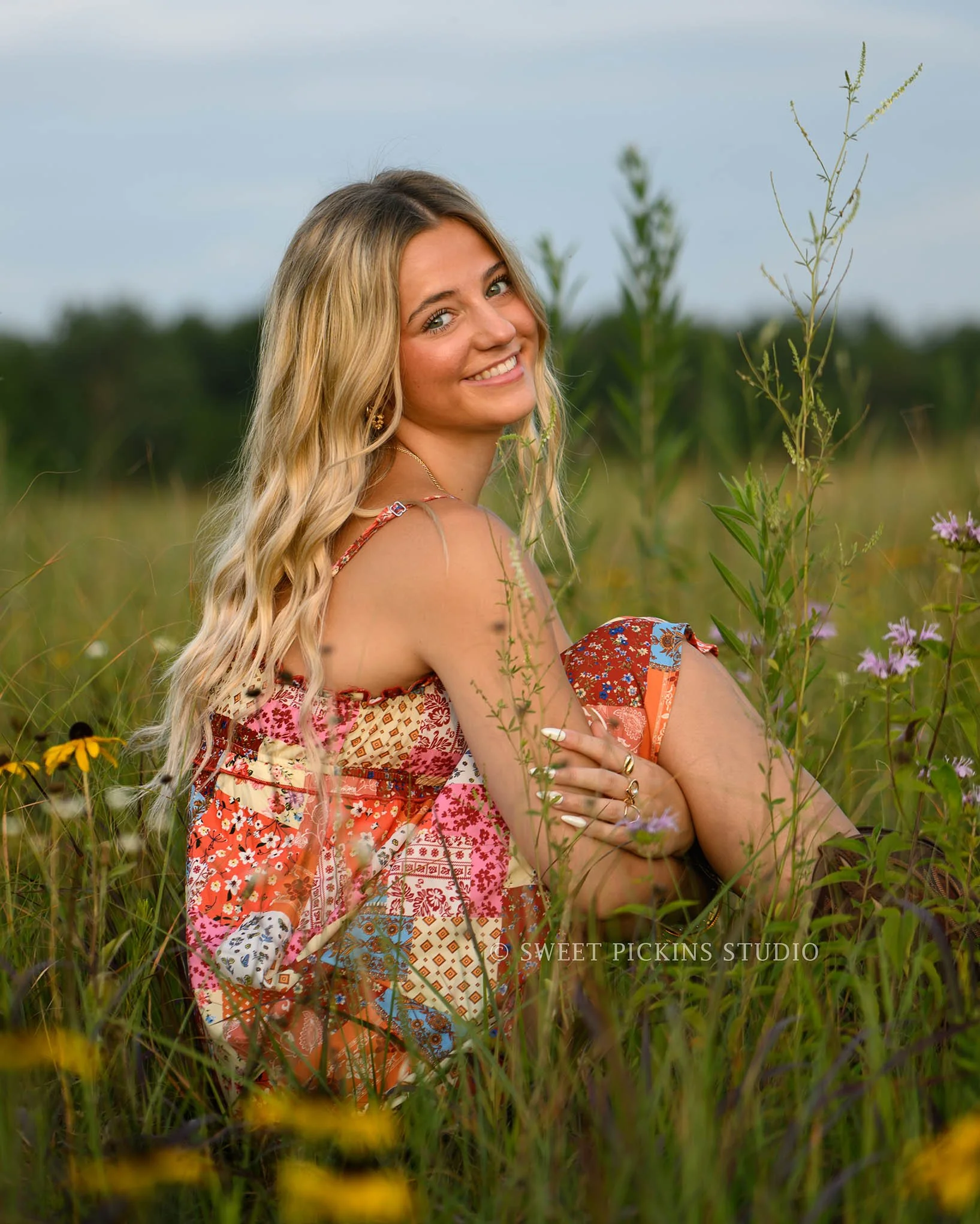 Addison’s Peru, Indiana Senior Photography in Wildflower Field at Sunset wearing patchwork babydoll dress with western cowboy boots in country location by Sweet Pickins Studio senior photographer Amanda Wilson  ©