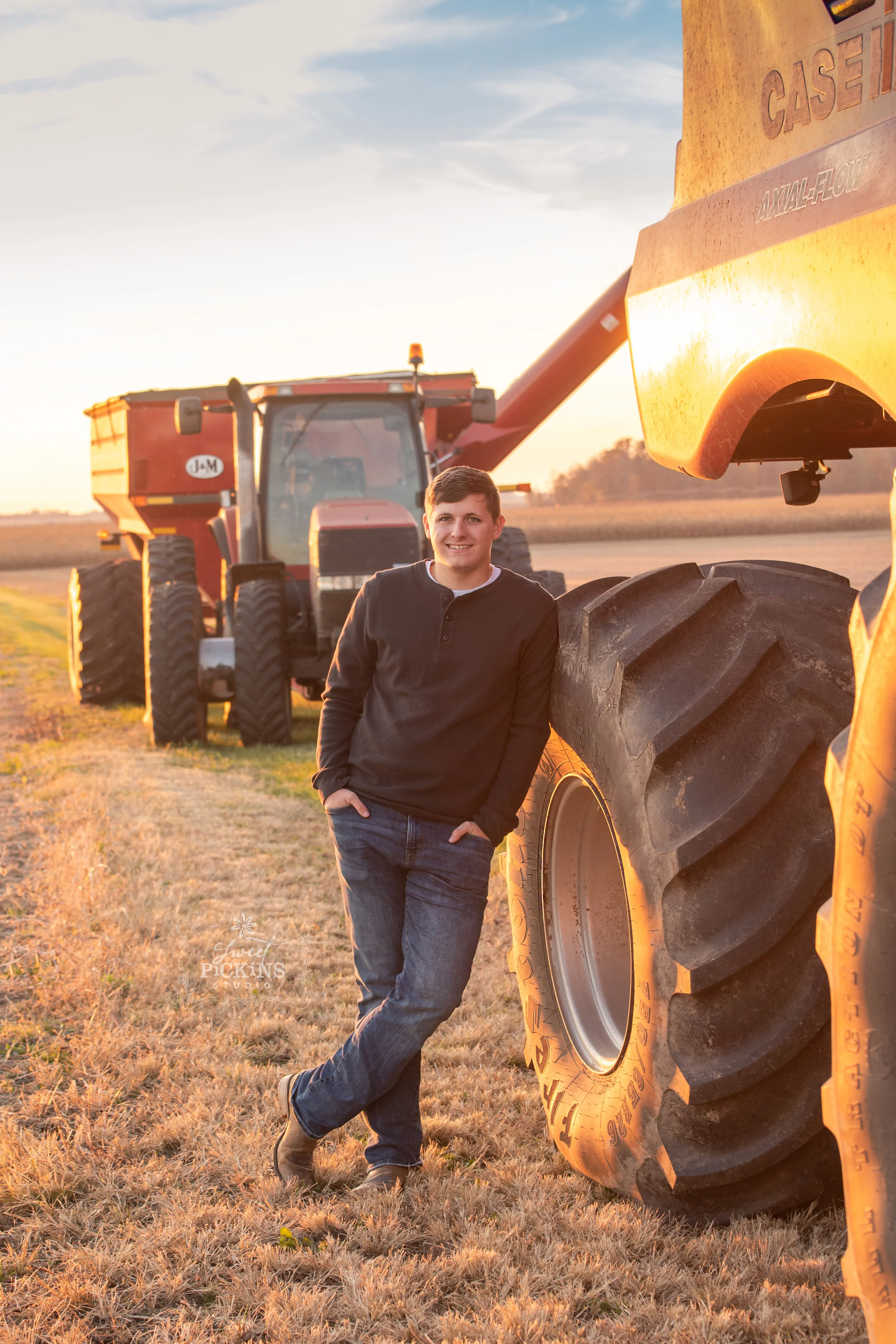 Farm Senior Guy with Red Case Tractors at Sunset (Copy)